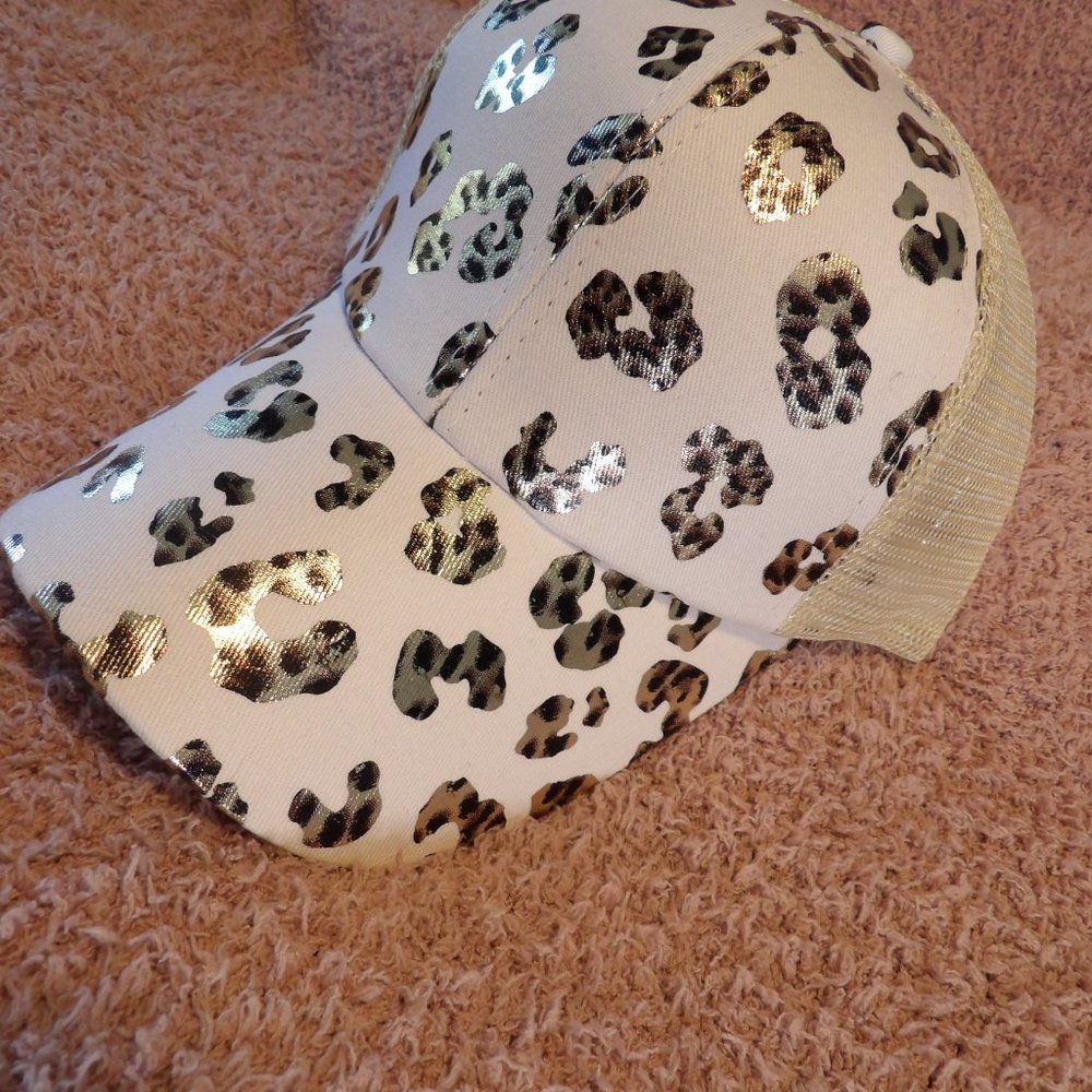 Leopard Print Womans Hat with crisscross on the back.